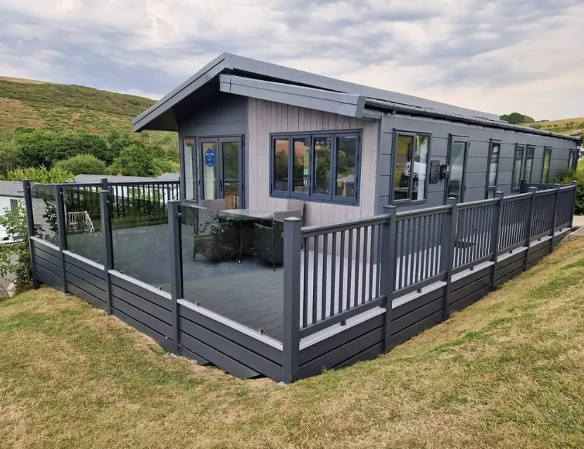 Anthracite composite decking with glass frontage in Budleigh Salterton