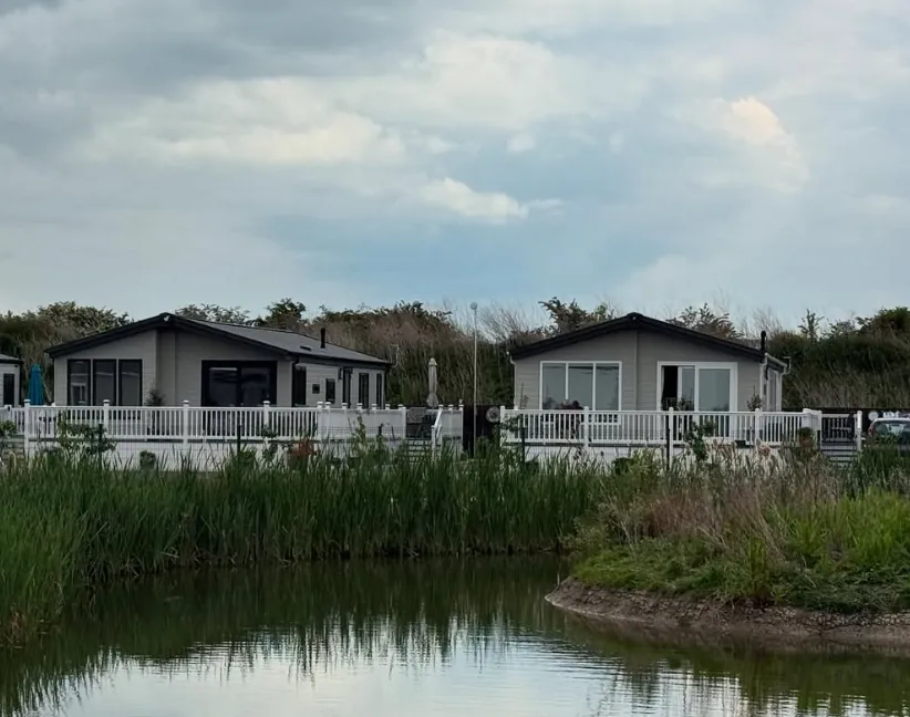 Twin waterside decks with white balustrades near Dawlish Warren